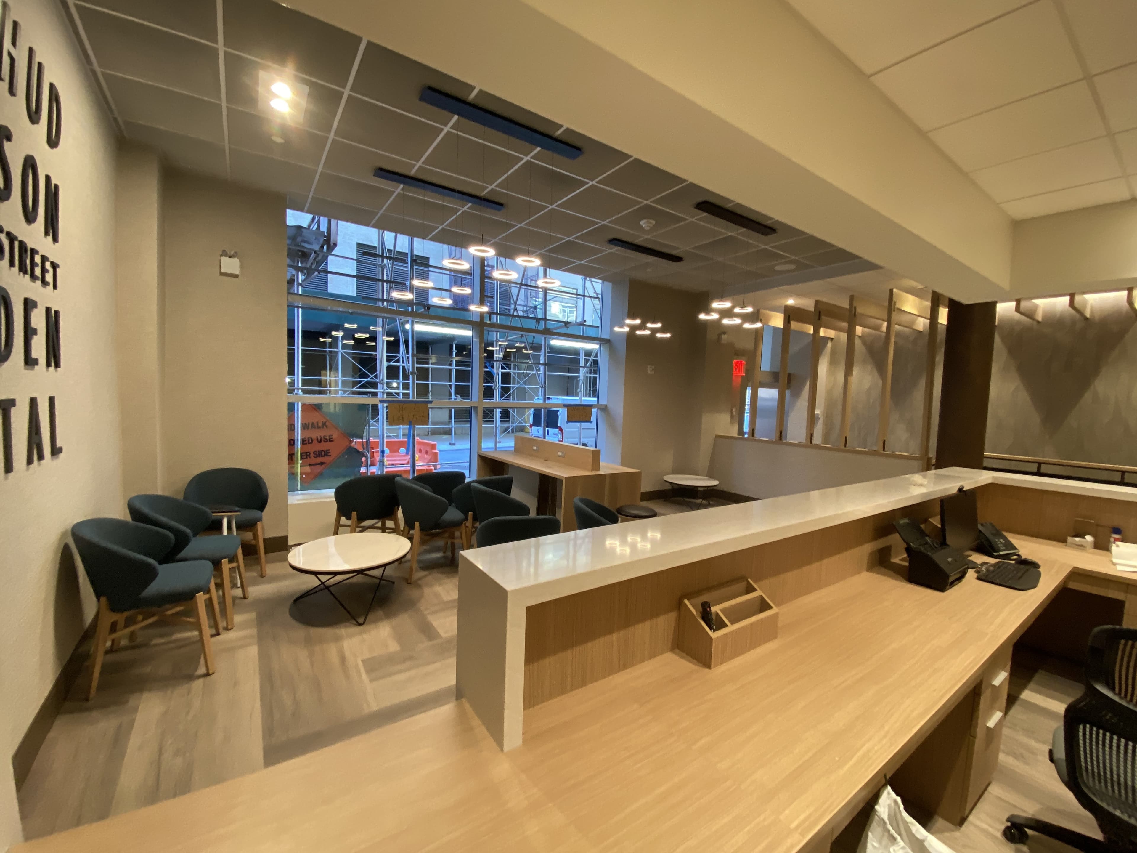 Finished commercial office with a custom wood communal table built by Deerfield Interiors, New York City